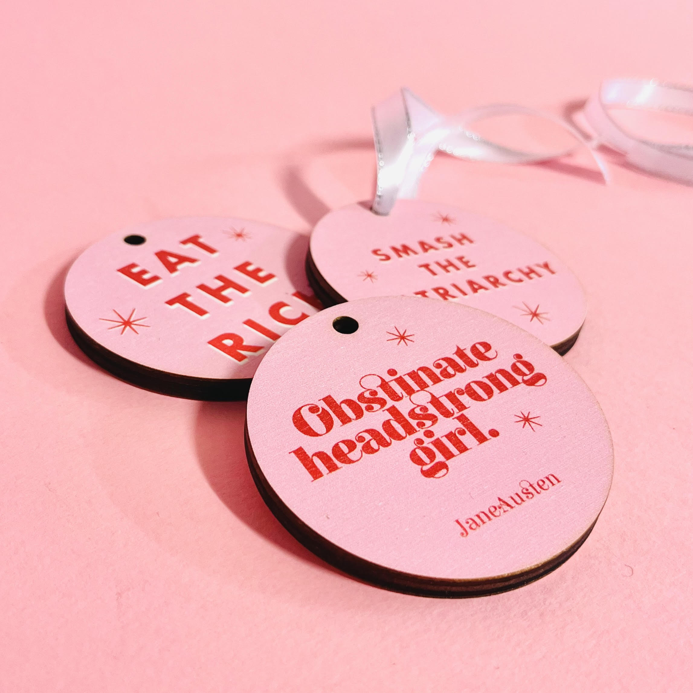 Bookish Christmas Tree decoration set of 3. Mix and Match available. Bright pink retro design. Colourful Christmas Tree Decor. Obstinate Headstrong Girl by Jane Austen. Perfect for book lovers, bookworms, bibliophiles and readers. Feminist festive hanging ornaments.