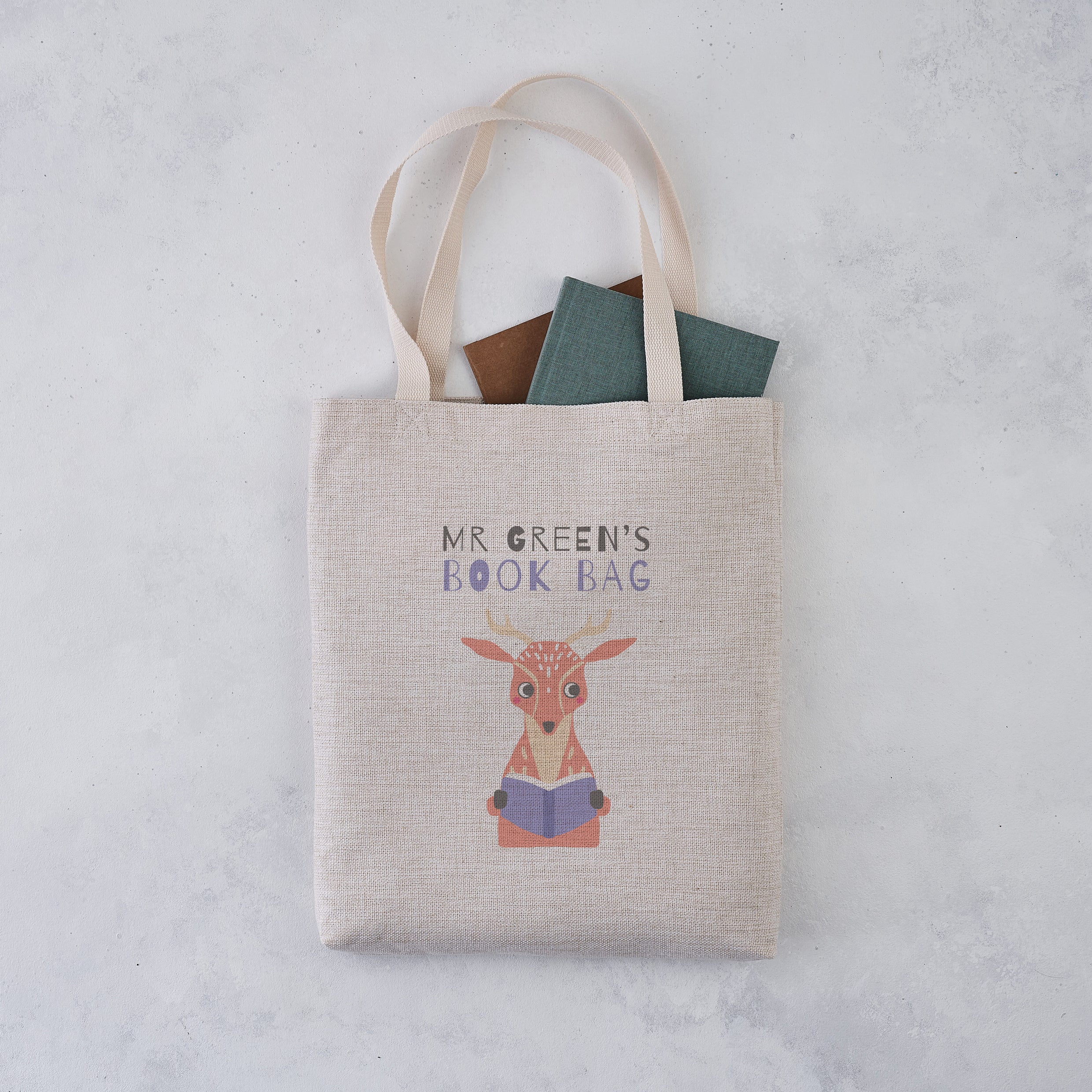 Tote bag with a deer illustration and 'Mr Green's Book Bag' text on a light gray background