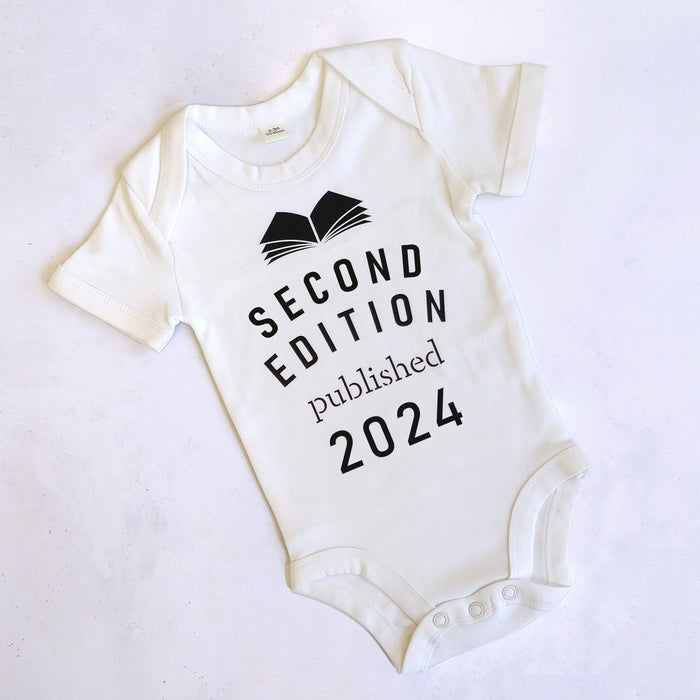 'Second Edition published 2024' Bookish Babygrow for literature loving new parents. Baby clothes for book lover, bookworm, reader and bibliophiles.