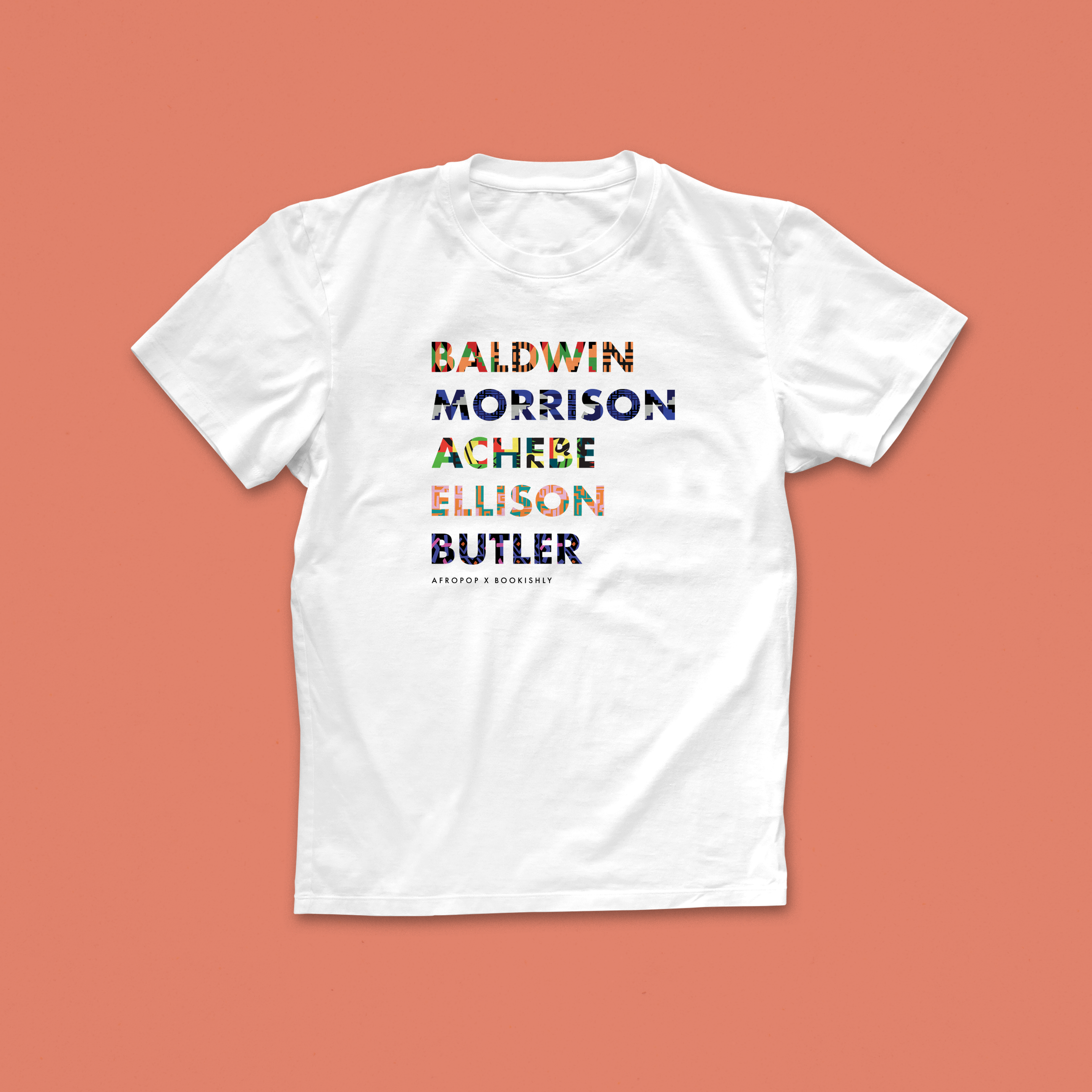 White Black Authors T-shirt featuring patterned names of Baldwin, Morrison, Achebe, Ellison, and Butler, part of the Afropop x Bookishly collaboration