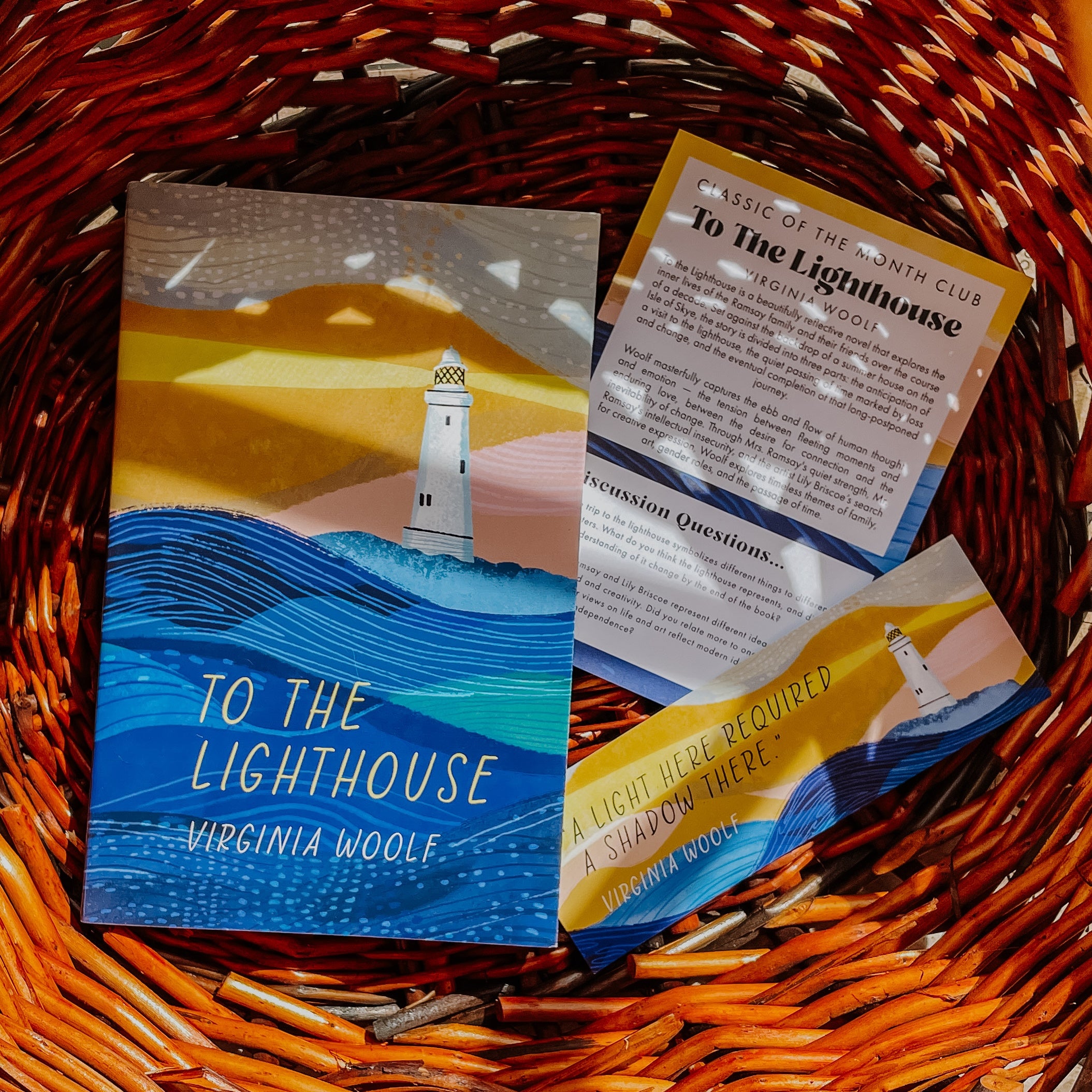 To The Lighthouse by Virginia Woolf book in a basket with a discussion card and bookmark.