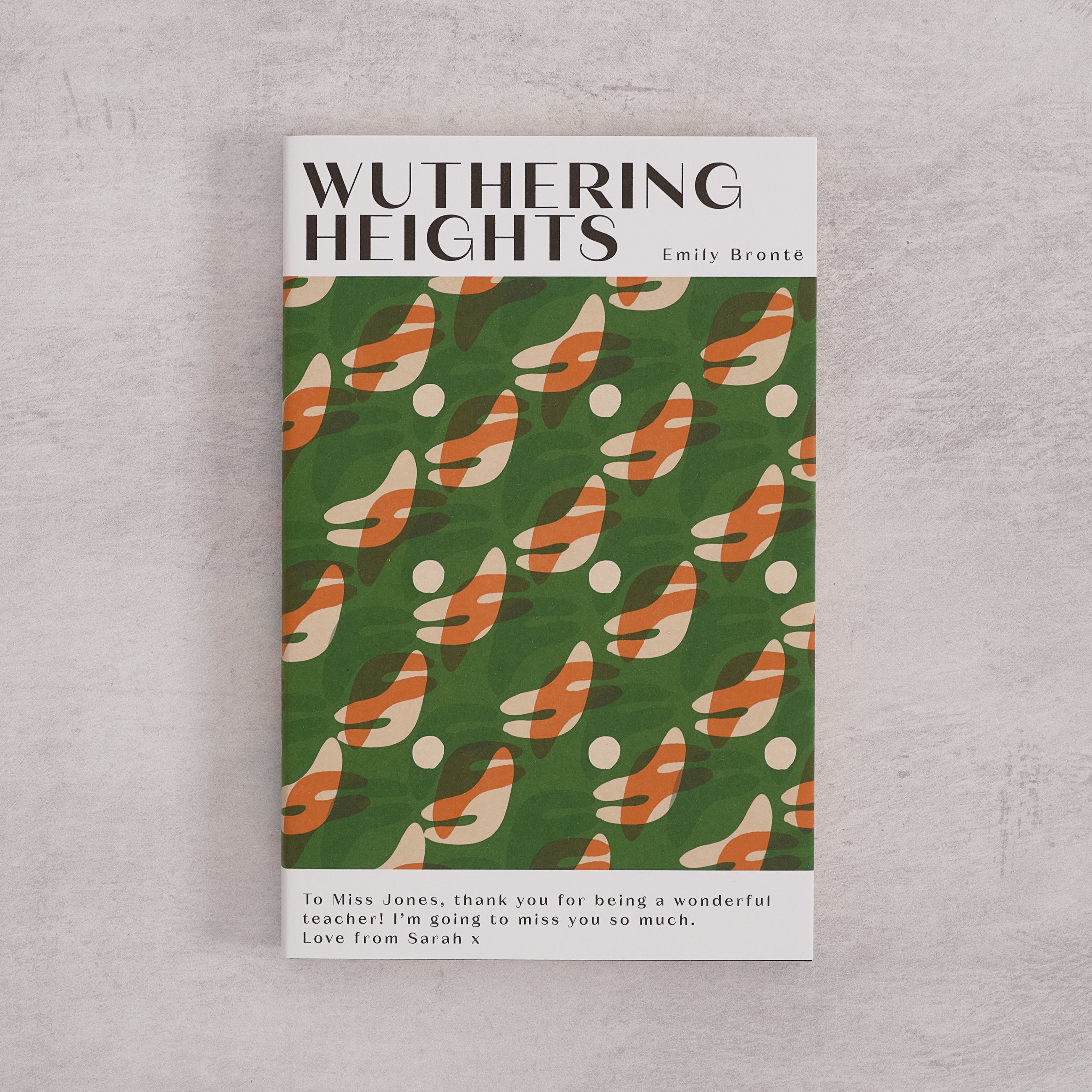 Bookishly edition of Wuthering Heights by Emily Brontë with a green patterned dust jacket and personalised message printed on the front cover.