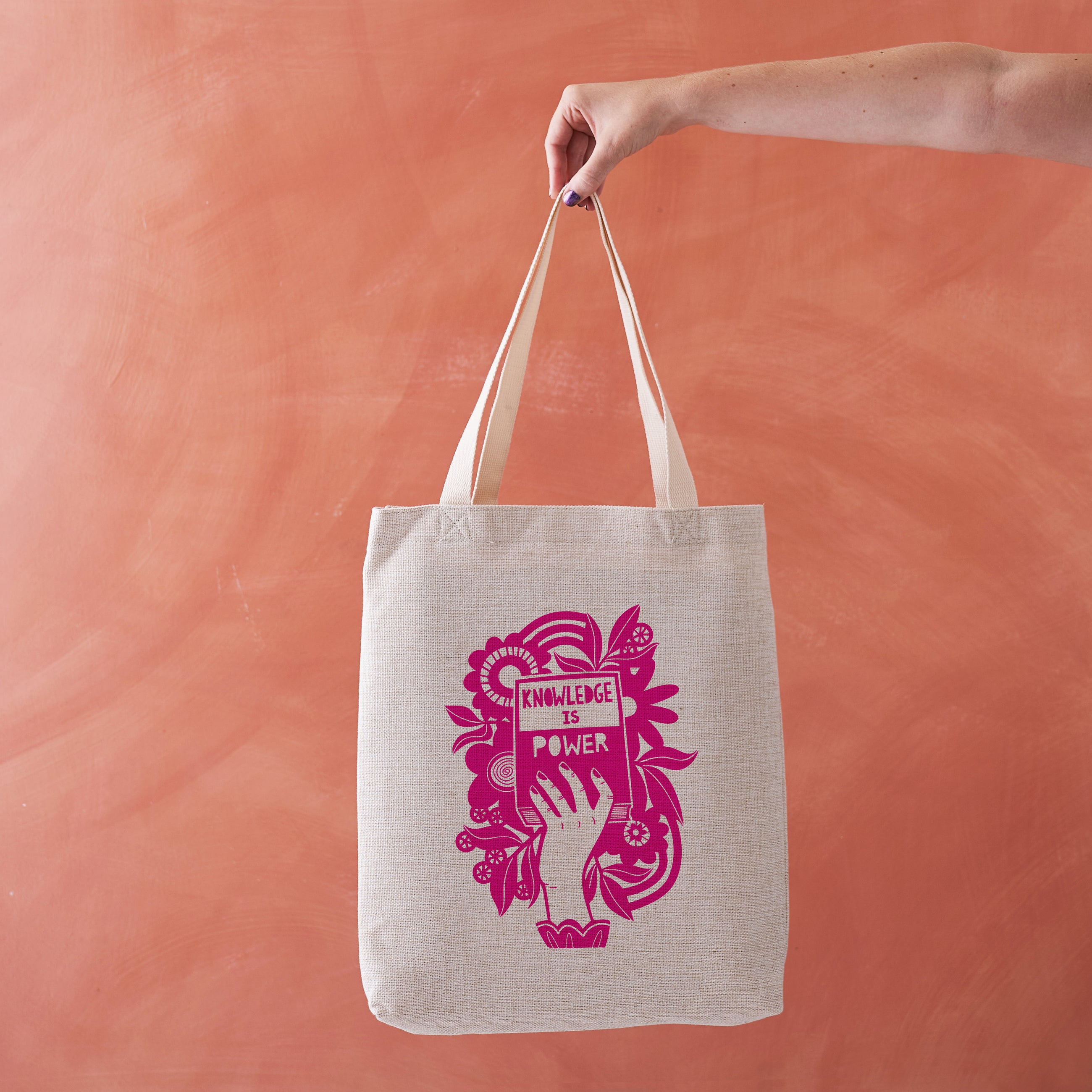 Linen-effect tote bag with purple “Knowledge is Power” hand-lettered design