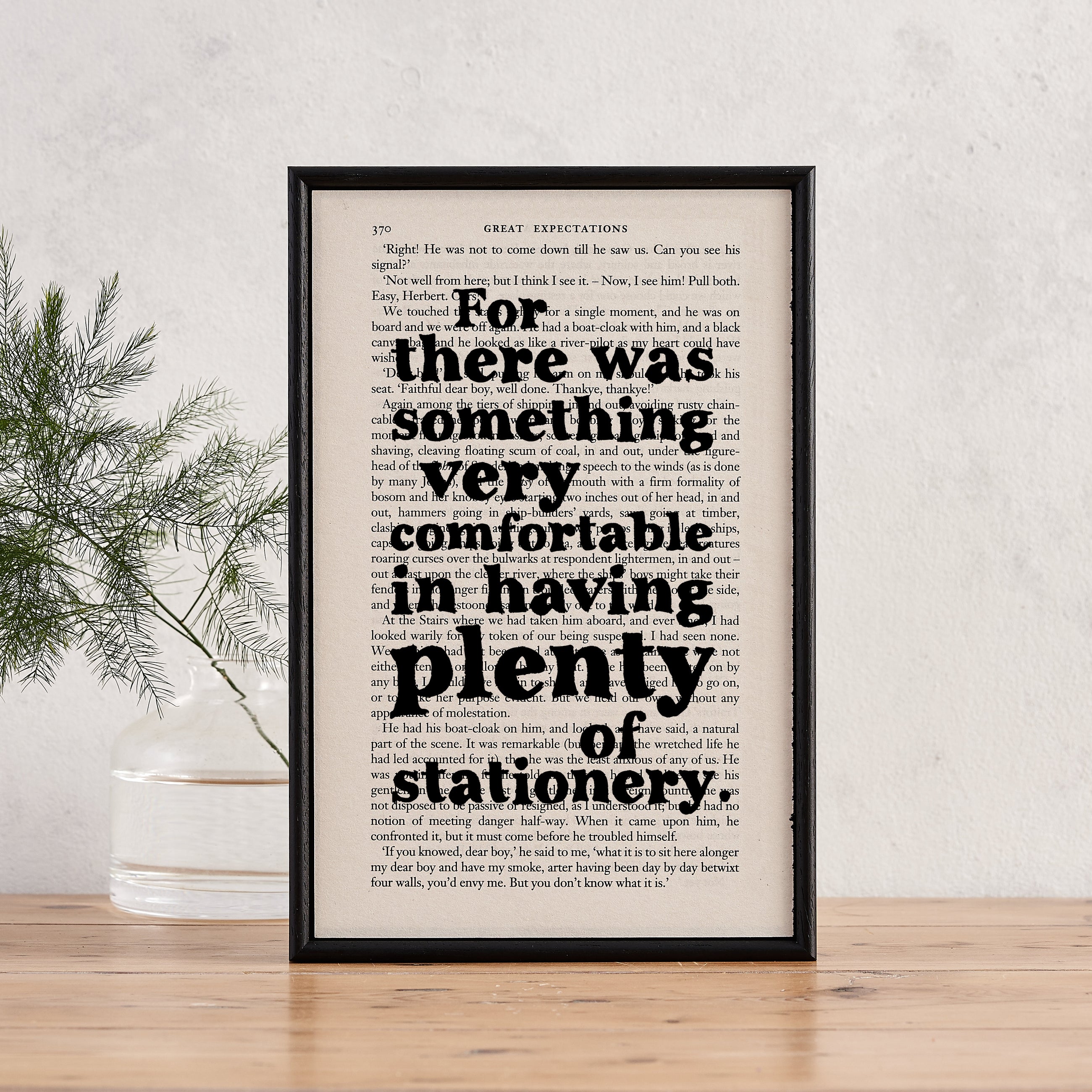 Framed book page print with the quote “There was something very comfortable in having plenty of stationery” from Great Expectations.