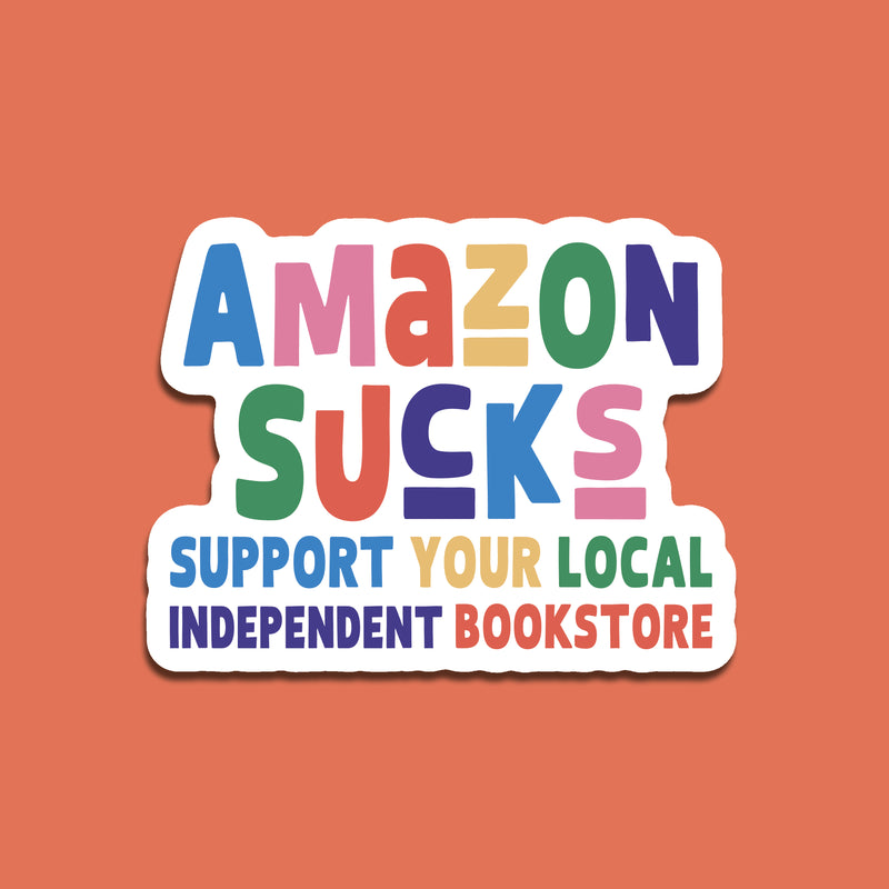 Colorful sticker with text 'Amazon Sucks Support Your Local Independent Bookstore' on a solid background