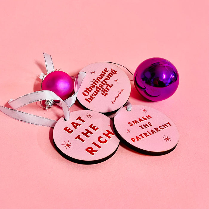 Bookish Christmas Tree decoration. Eat the Rich Activist. Mix and Match available. Bright pink retro design. Colourful Christmas Tree Decor. Activism Christmas Decor. Political Gifts. Perfect for book lovers, bookworms, bibliophiles and readers. Feminist festive hanging ornaments. Political Gifts.