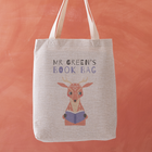 Personalised book bag tote with a deer holding a blue book and the text “Mr Green’s Book Bag” printed above.