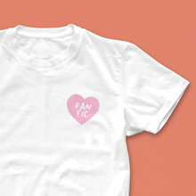 Fan Fic T-shirt with small pink heart and hand-drawn lettering, designed for fanfiction lovers and bookish readers
