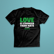 Black t-shirt with 'Love is Stronger Than Hate' text on a teal background