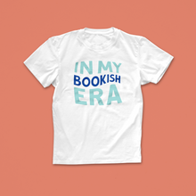 In My Bookish Era T-shirt with bold pastel and blue lettering – a playful bookish tee inspired by reading phases and pop culture trends