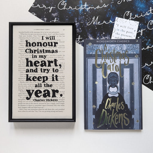 Christmas Carol by Charles Dickens and a Christmas themed Book Page Print with the quotes 'I will honour Christmas in my heart, and try to keep it all the year.' Perfect for book lovers, bookworms, readers and bibliophiles. Bookishly.