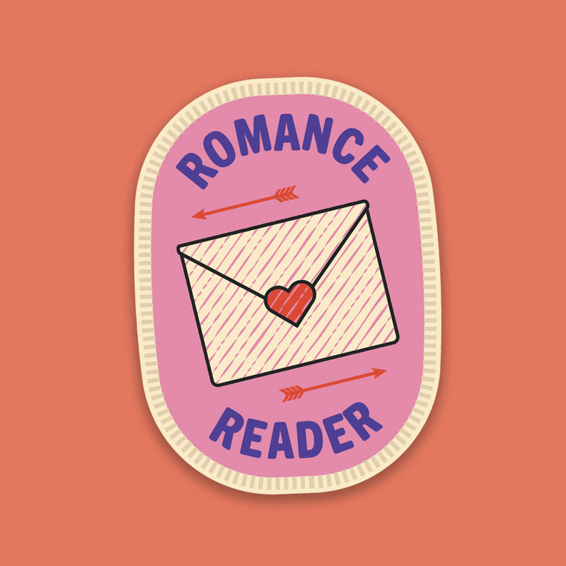 “Romance Reader” sticker in the style of a pink stitched merit badge, featuring a love letter design on a soft pink background.
