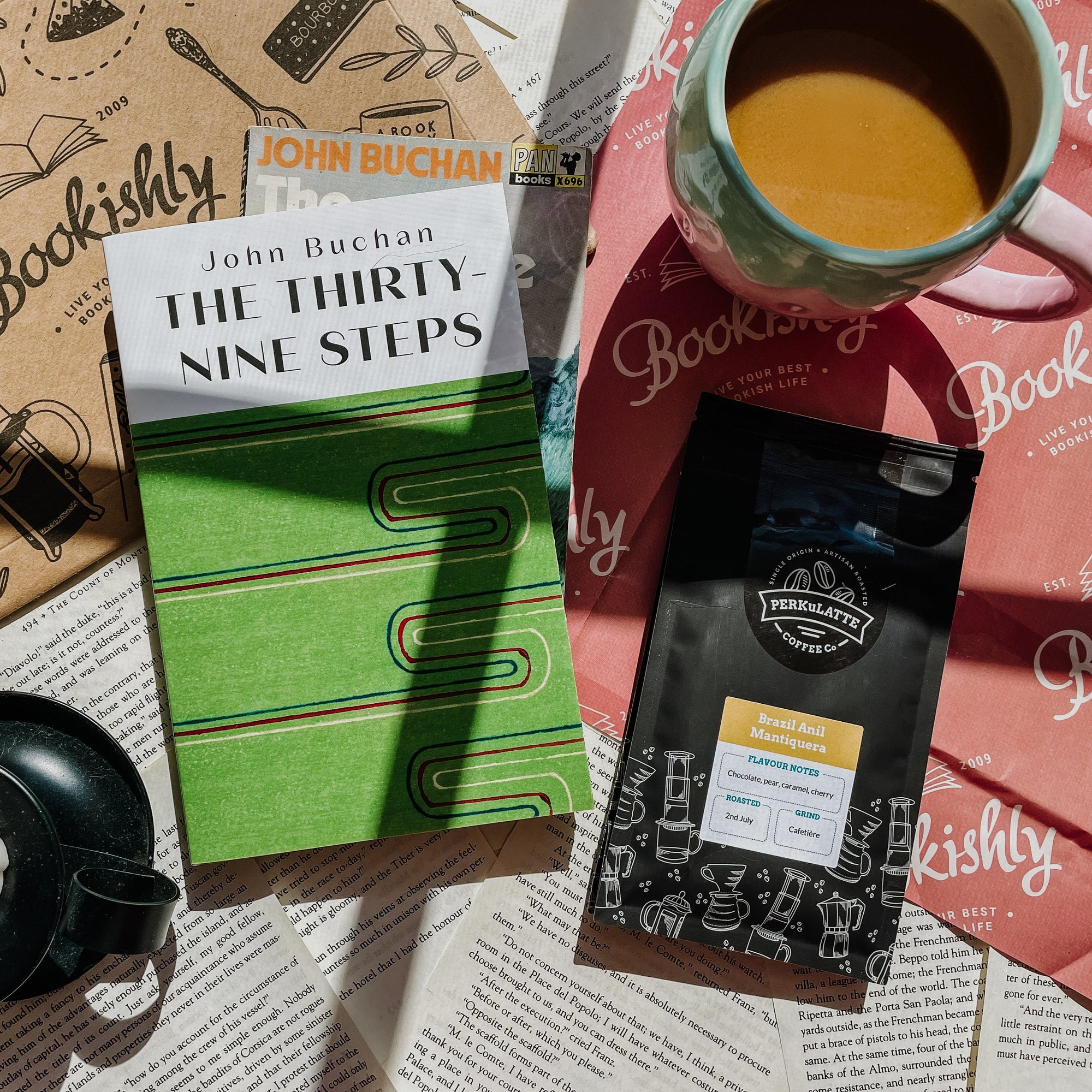 Bookishly's Crime and Thriller subscription - The Thirty Nine Steps by John Buchan with a green cover and a packet of coffee.
