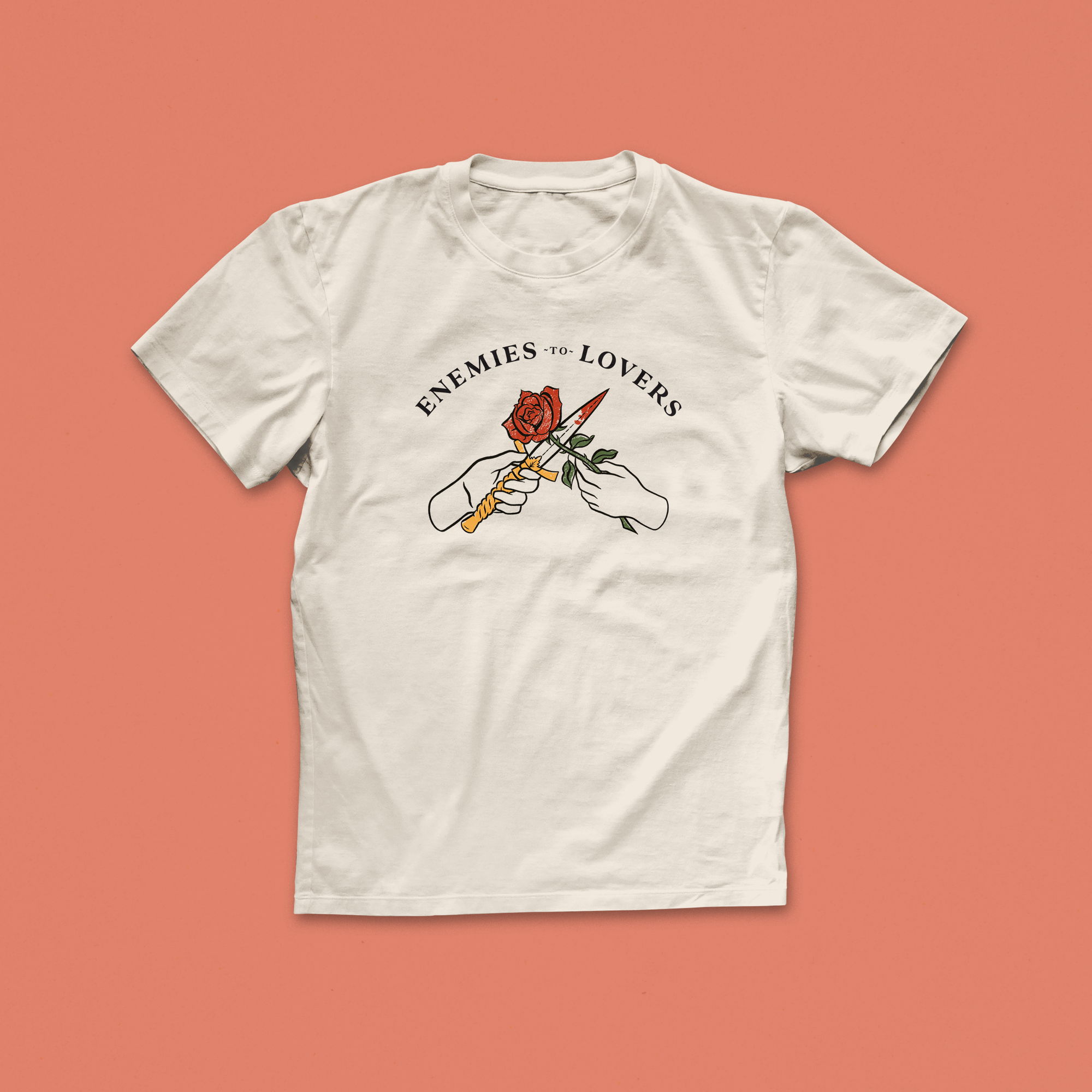 Enemies to Lovers T-shirt with illustrated hands holding a rose and dagger, bookish romance trope tee for readers and fiction fans