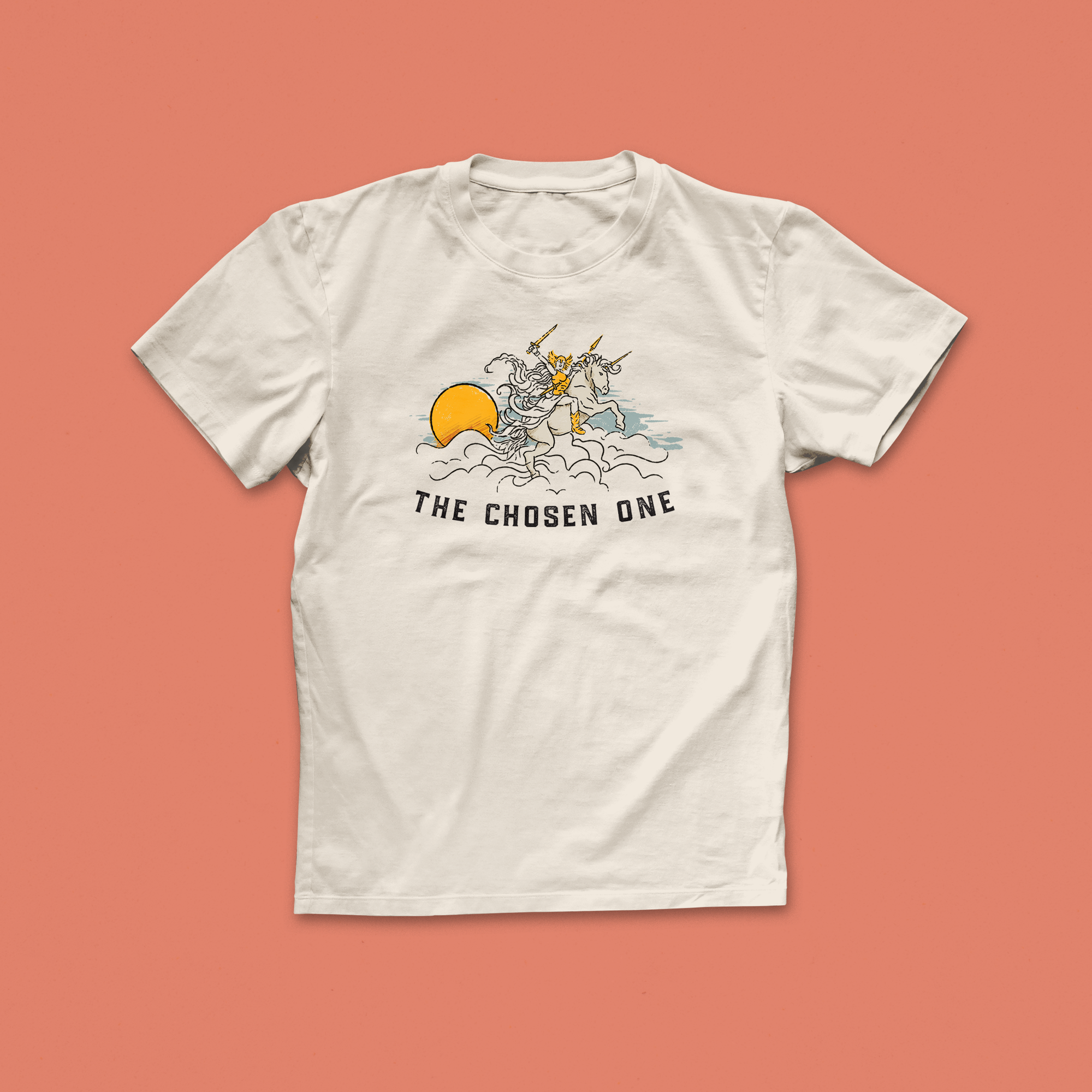 The Chosen One T-shirt with whimsical illustrated design of a unicorn rider holding a sword, rising through clouds, fantasy-inspired reader tee
