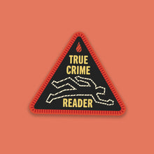 “True Crime Reader” sticker designed like a red and black stitched merit badge, with a chalk outline illustration on a black background.
