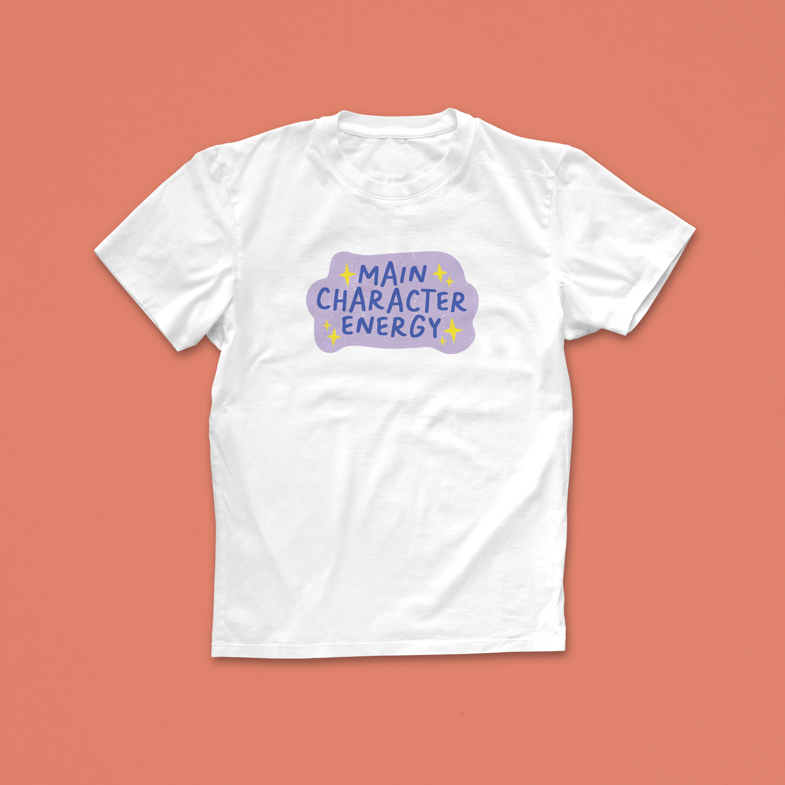 Main Character Energy T-shirt with purple and yellow hand-drawn text and sparkles, perfect for book lovers with big story vibes