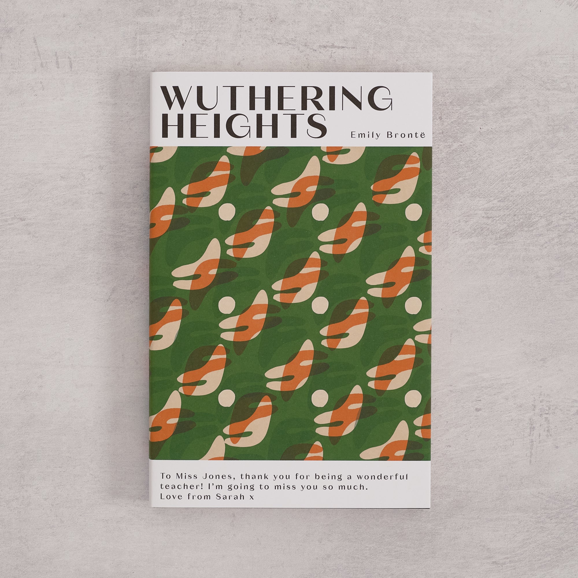 Bookishly edition of Wuthering Heights by Emily Brontë with a green patterned dust jacket and personalised message printed on the front cover.