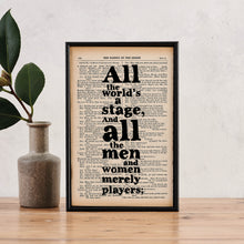 Framed book page print featuring the quote “All the world’s a stage. And all the men and women merely players” printed in bold black type on a page from The Complete Works of William Shakespeare.