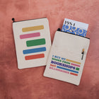Fabric book sleeve with 'I buy my books from bookshops not billionaires on one side and a colour block design on the other.