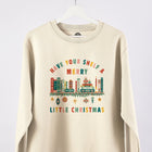 A cream sweatshirt with a Christmas bookshelf design and the wording 'Have your shelf a merry little Christmas.'