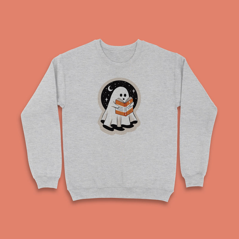 Grey sweatshirt with a cute ghost reading a book under the stars, Halloween theme.