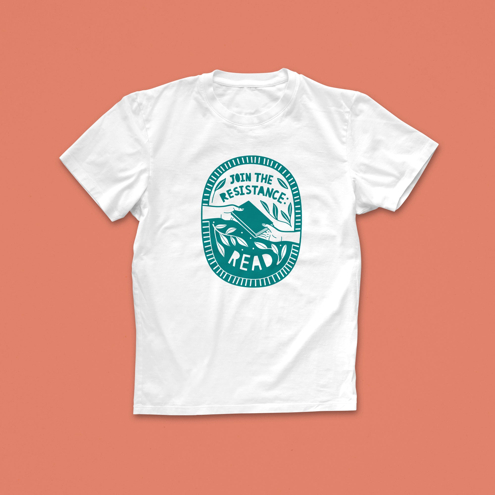 Join the Resistance Read T-shirt with hand-drawn activist-style illustration in green, featuring two hands passing a book and bold lettering

