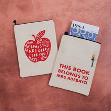 Personalised book sleeve featuring “Books Are Good for You” red apple design on one side and “This Book Belongs To Mrs Adebayo” on the other.