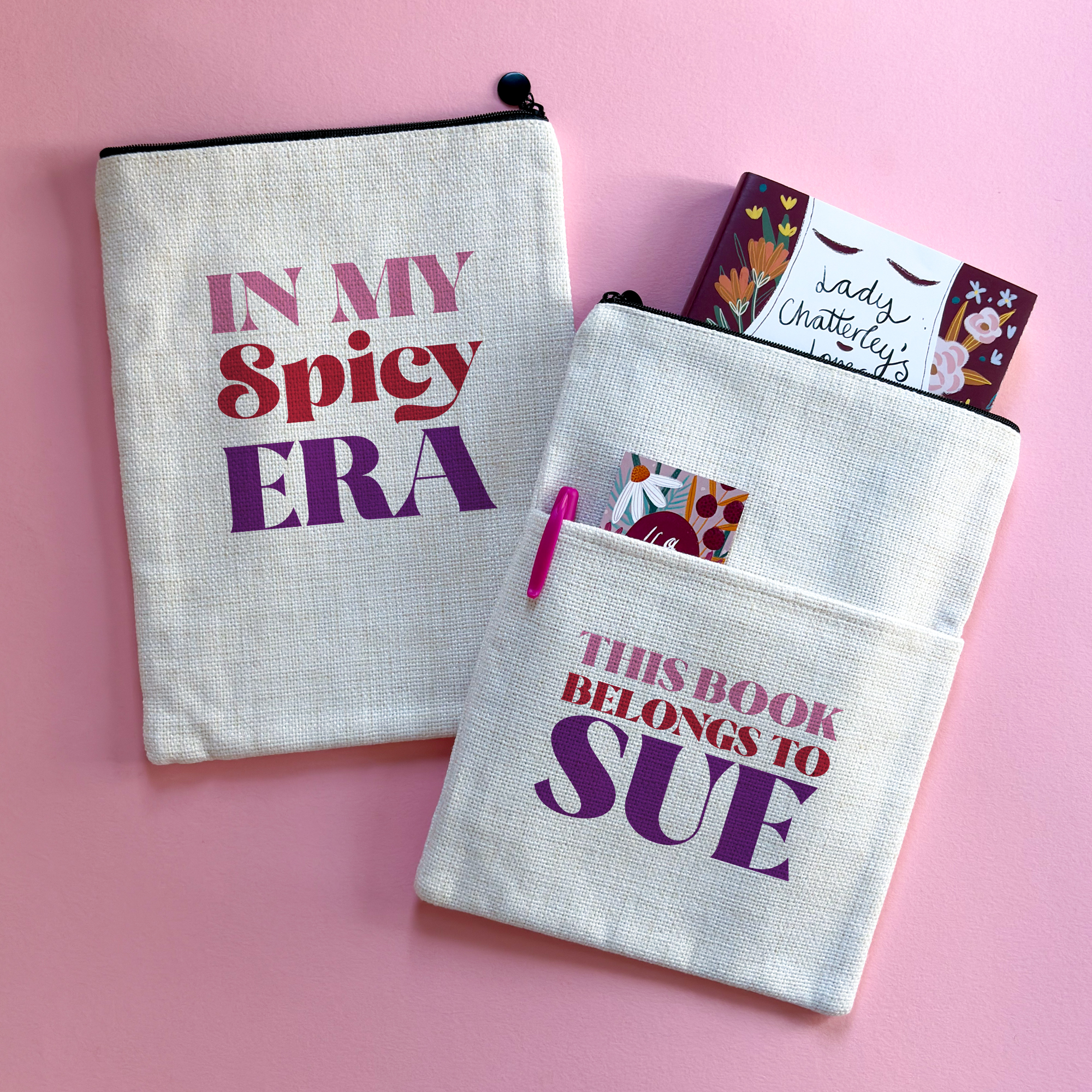 Personalised book sleeve featuring “In My Spicy Era” design on one side and “This Book Belongs To Sue” on the other, styled on a pink background with a copy of Lady Chatterley’s Lover.