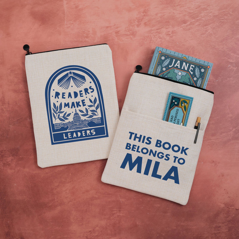 Personalised book sleeve featuring “Readers Make Leaders” design on one side and “This Book Belongs To Mila” text on the other.