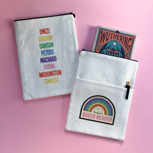 Double-sided Queer Reader book sleeve with rainbow badge design on one side and LGBTQ+ author list in rainbow text on the other, styled on a pink background.