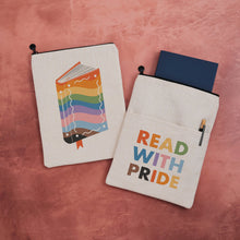 Fabric book sleeve featuring a rainbow coloured book on one side and Read with Pride on the other.