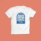 Readers Make Leaders T-shirt with blue hand-drawn illustration of an open book, leaves, and a civic building, designed for book lovers and changemakers
