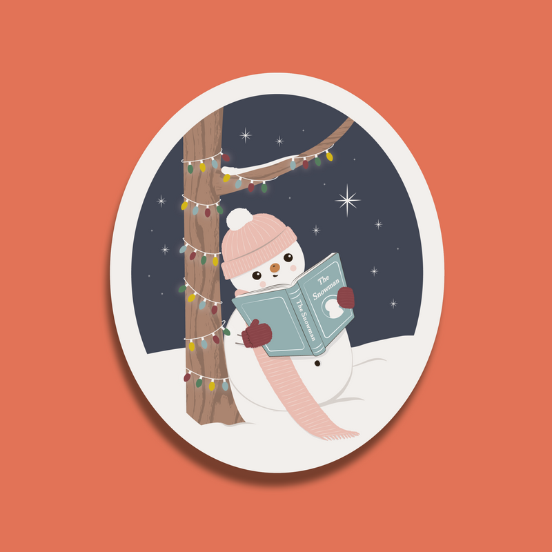 Illustrated sticker of a snowman reading a book under a tree with fairy lights on a snowy night.