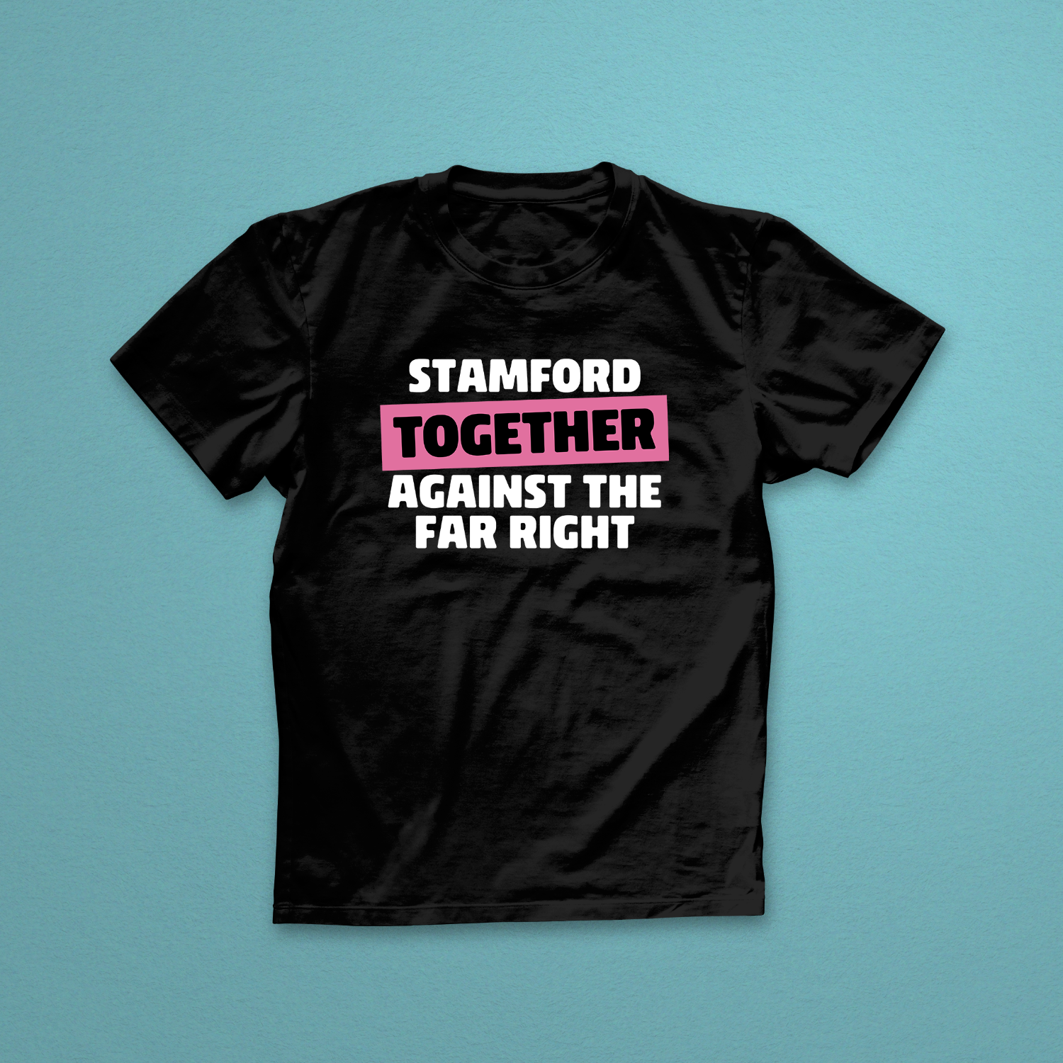 Black t-shirt with text 'STAMFORD TOGETHER AGAINST THE FAR RIGHT' on a teal background