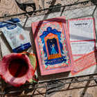 Vanity Fair book and tea packaging with a cup of tea on a decorative surface