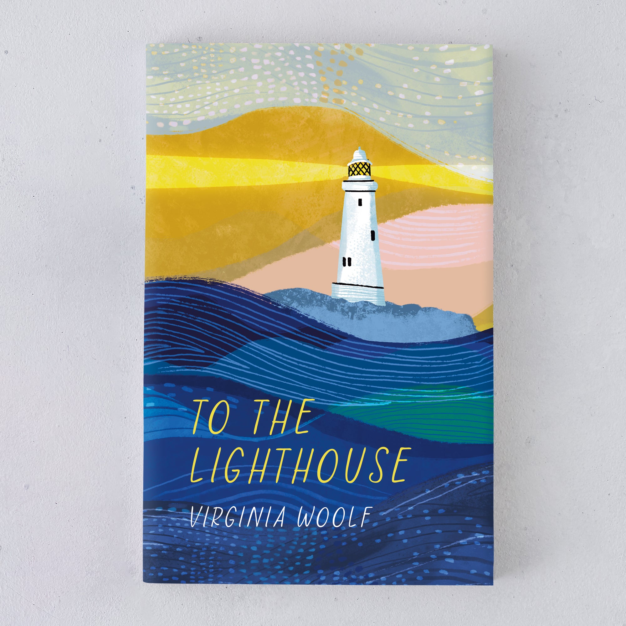 Illustrated book cover of To The Lighthouse by Virginia Woolf with a white lighthouse shining over stylised blue waves and golden hills, designed by Bookishly.