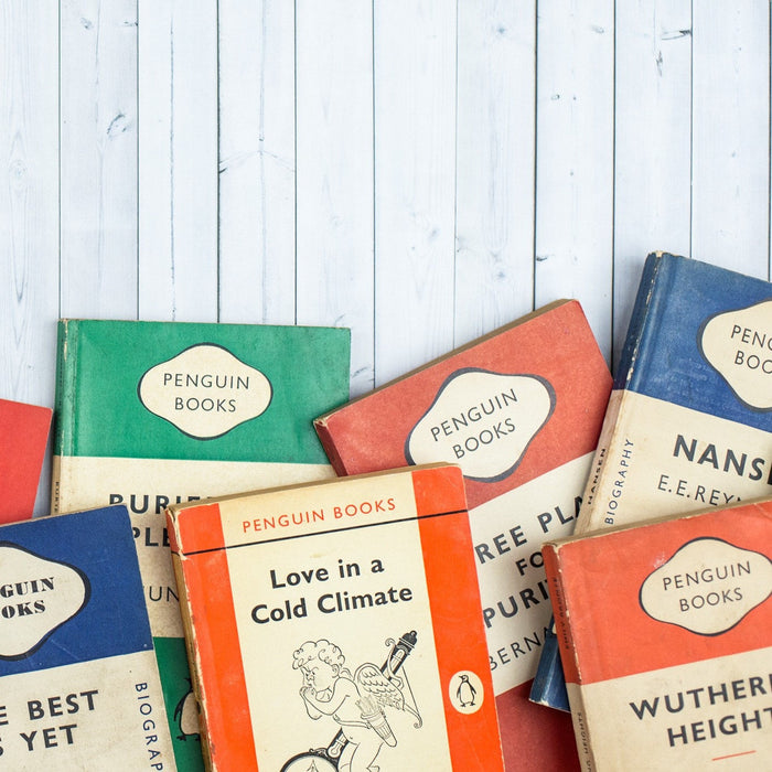 A beautifully arranged set of 6 vintage Penguin green paperbacks, showcasing their distinctive covers and well-preserved condition. Each book exudes a sense of nostalgia and promises thrilling tales of mystery and crime within their pages.