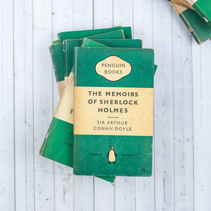 A beautifully arranged set of 6 vintage Penguin green paperbacks, showcasing their distinctive covers and well-preserved condition. Each book exudes a sense of nostalgia and promises thrilling tales of mystery and crime within their pages.