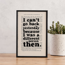 Framed book page print with the quote “I can’t go back to yesterday because I was a different person then” from Alice’s Adventures in Wonderland by Lewis Carroll