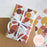 Premium gift wrap example with ribbon on geometric style paper designed by Bookishly.