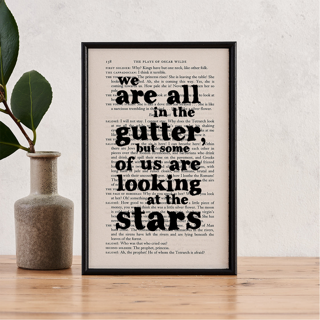 Framed book page art with the Oscar Wilde quote “We are all in the gutter, but some of us are looking at the stars” printed on a page from The Plays of Oscar Wilde