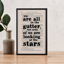 Framed book page art with the Oscar Wilde quote “We are all in the gutter, but some of us are looking at the stars” printed on a page from The Plays of Oscar Wilde
