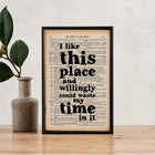 Framed book page art featuring the quote: “I like this place and willingly could waste my time in it” from As You Like It by William Shakespeare.